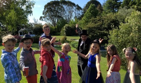 Magician entertaining kids at a wedding ceremony